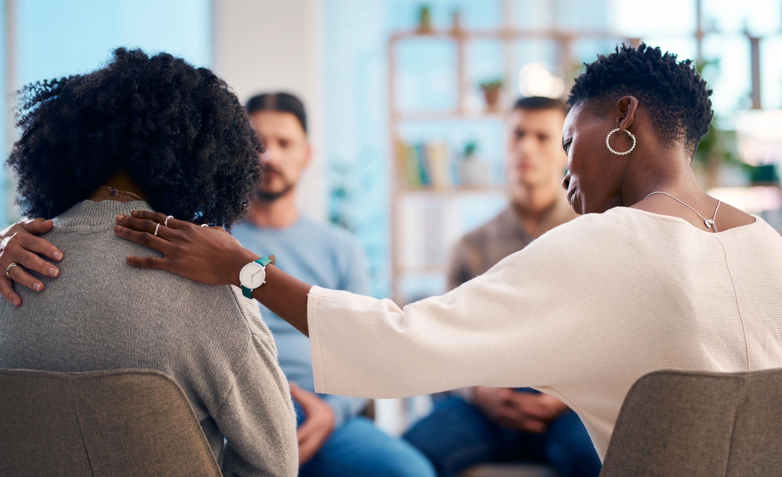 Women in a healing wellness group